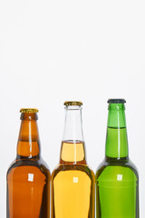 Set of bottles with beer. Cropped image of several bottles of alcoholic beverage.