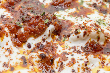 Obraz na płótnie Canvas Turkish Ravioli with yogurt and tomato sauce . Plates of traditional Turkish food.