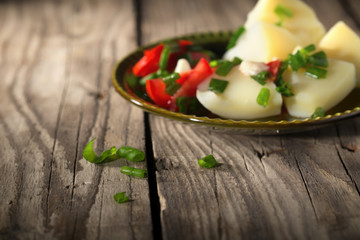 Boiled potato with tomatoes and green onions
