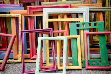 Fototapeta na wymiar Rainbow art frames stacked at a San Francisco Flea Market 