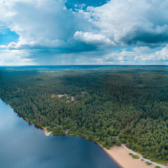 Aerial view of the lake, forest and rain clouds