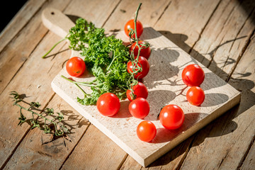 Vintage cherry tomatoes on a wooden table