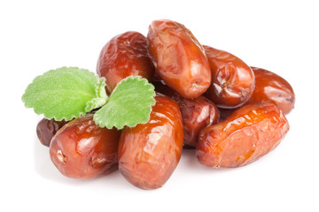 Dates with mint leaves isolated on white background