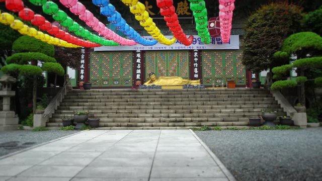 Busan, South Korea-02 July, 2017: 4K Entrance of Daegaksa a Buddhist temple of the Jogye Order in Busan. The golden Amita-bul lying on the main altar, Buddha of the Western Paradise. South Korea.-Dan