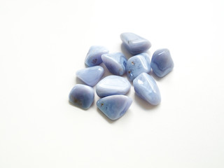 Tumbled Chalcedony Quartz stones close up for crystal therapy treatments and reiki