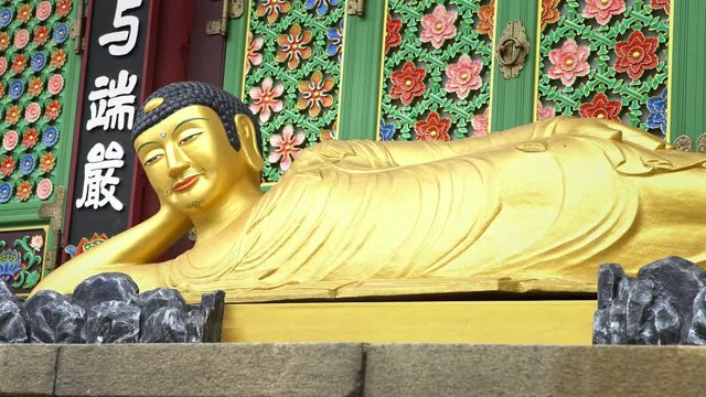Busan, South Korea-02 July, 2017: 4K Golden Amita-bul lying on altar, Buddha with Moustache and beard in Daegaksa Buddhist temple of Jogye Order in Busan. Buddha of Western Paradise. South Korea-Dan
