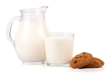 jug of milk with oatmeal cookies isolated on white background