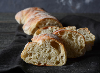 Sliced bread on a black background.