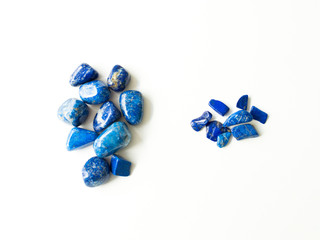 Tumbled lapis lazuli Quartz stones and fragments for crystal therapy treatments and reiki