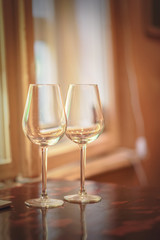 Wine glass in a restaurant closeup, warm and elegant