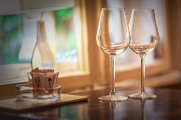 Wine glass in a restaurant closeup, warm and elegant