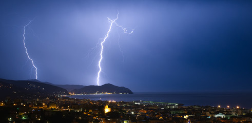 Naklejka na ściany i meble Lightning and thunderstorm on the Tigullio Gulf - Ligurian sea - Chiavari - Italy