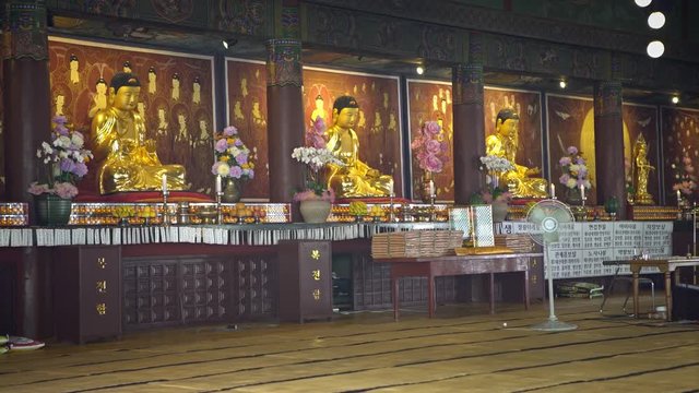 Busan, South Korea-02 July, 2017: 4K Golden shrine hall with Amita-bul and Seokgamoni-bul sitting, Daegaksa Buddhist temple of Jogye Order, Busan. Buddha of Western Paradise and Historical Buddha-Dan