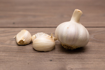 Isolated garlic on top of a wooden table