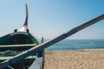 Arte Xavega typical portuguese old fishing boat on the beach in Paramos, Espinho, Portugal. © anammarques
