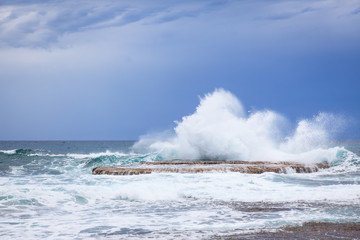 Waves crashing on rock
