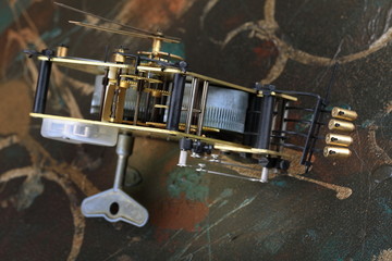 Old clock mechanism on a dirty background.