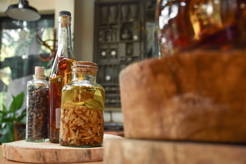 Original bottles with different products and plants