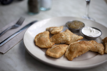 Pierogi With Sour Cream and Applesauce