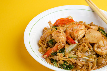 Stir fried flat rice noodle or char kway teow that is famous among Indonesian, Malaysian and Singaporean as breakfast or another meal