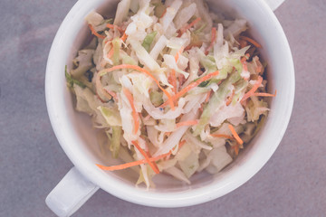 Fresh organic salad with cabbage and carrots. Healthy fresh vegetable salad. Bali island.