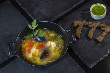 Seafood soup. Soup from salmon, pike perch, shrimp, octopus and mussels with croutons