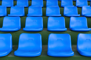 Fototapeta premium lines of blue stadium seats horizontal composition