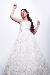 Fototapeta na wymiar Portrait of beautiful young woman bride in white Wedding Dress