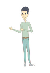Young asian man pointing to the side.
