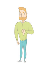 Young caucasian hippie man with thumb down.