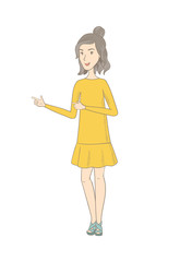 Young caucasian hippie woman pointing to the side.