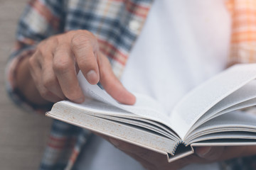 Young man reading book