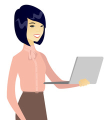 Fototapeta premium Young asian business woman using a laptop.