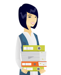 Young asian business woman holding pile of folders