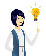 Business woman pointing at business idea bulb.