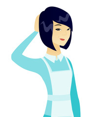 Young asian cleaner scratching her head.