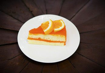 orange cake on wood background
