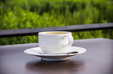 black coffee on the wood table with natural blackground