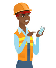 Young african builder holding a mobile phone.