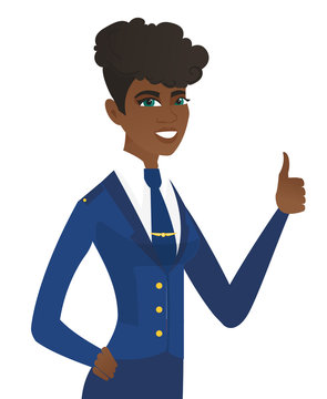 Young african-american stewardess giving thumb up.
