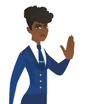 Young african stewardess showing stop hand gesture