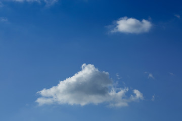 fluffy cloud on clear blue sky