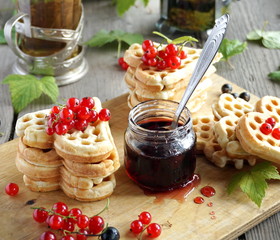 Waffles with red currants and jam