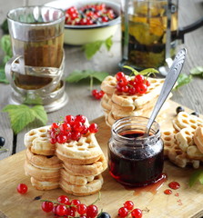 Waffles with red currants and jam