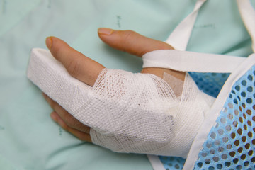 White medicine bandage on broken finger