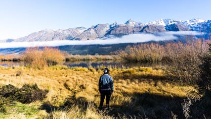 Girl standing in front of mountains