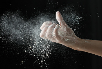 Fototapeta na wymiar Hands in flour
