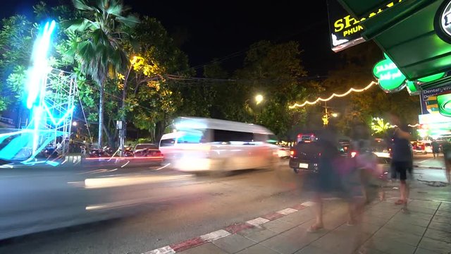 Hyperlapse on the night street with traffic and people. Phuket. Thailand.