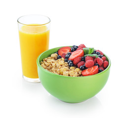 Muesli with fresh berries in a bowl isolated on white background.