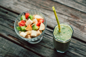 fresh fruit salad in a bowl and smoothies